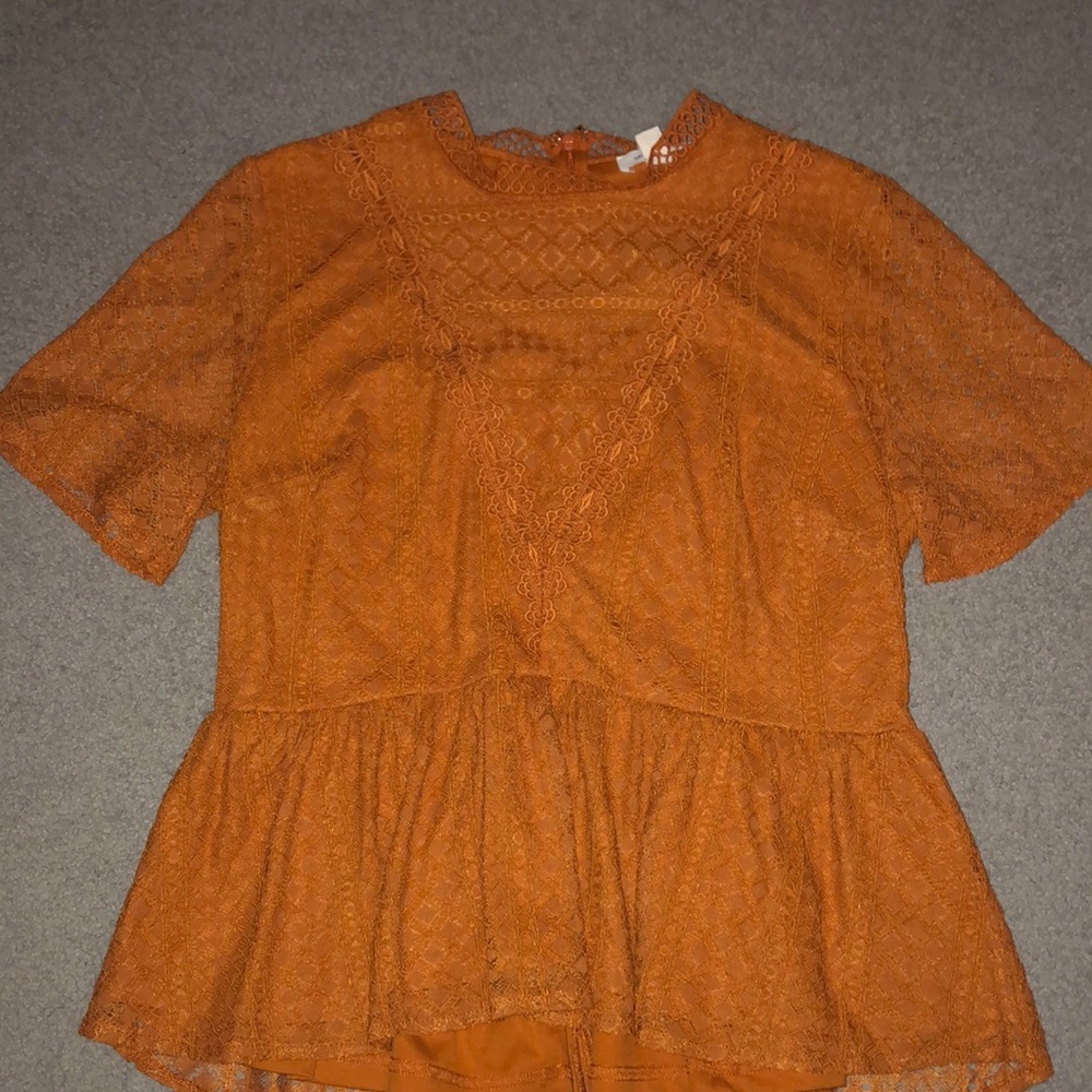 burnt orange frilly blouse